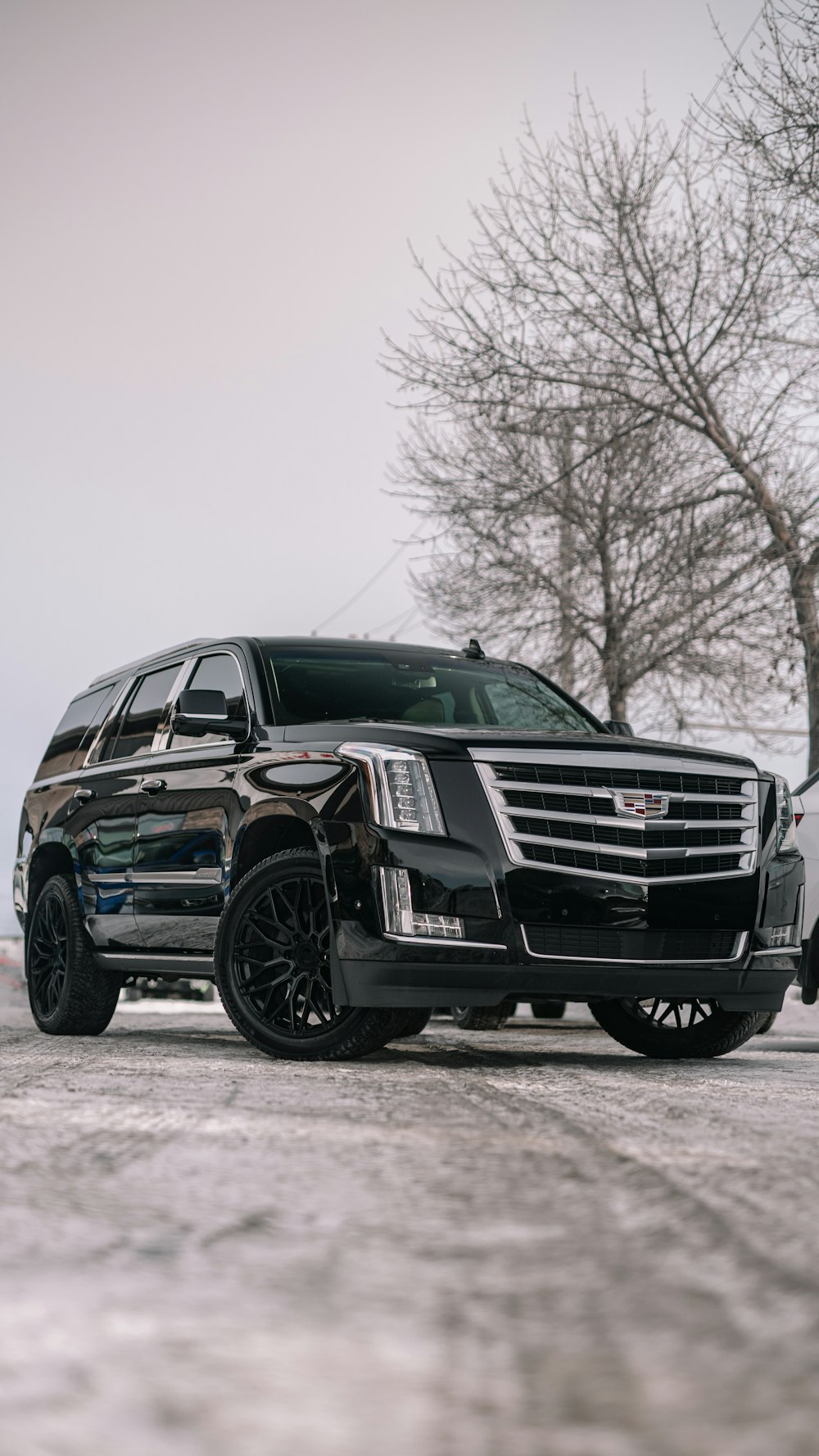 Black Escalade on a winter street
